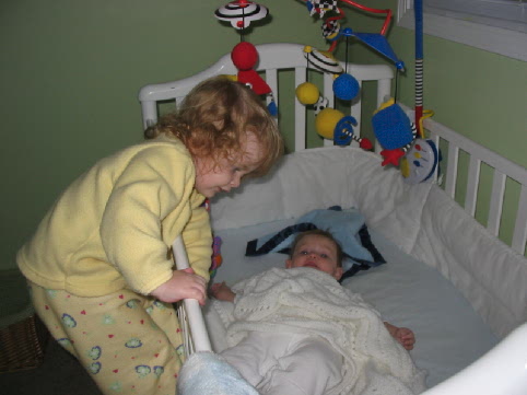 2004_10_28 Jane climbing into crib to see Cate.jpg